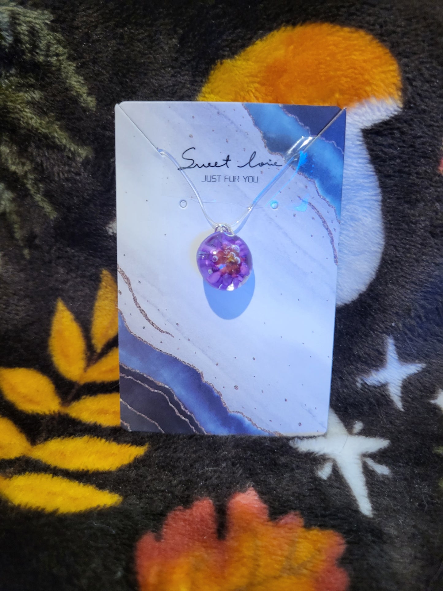 Dried flower in resin charm