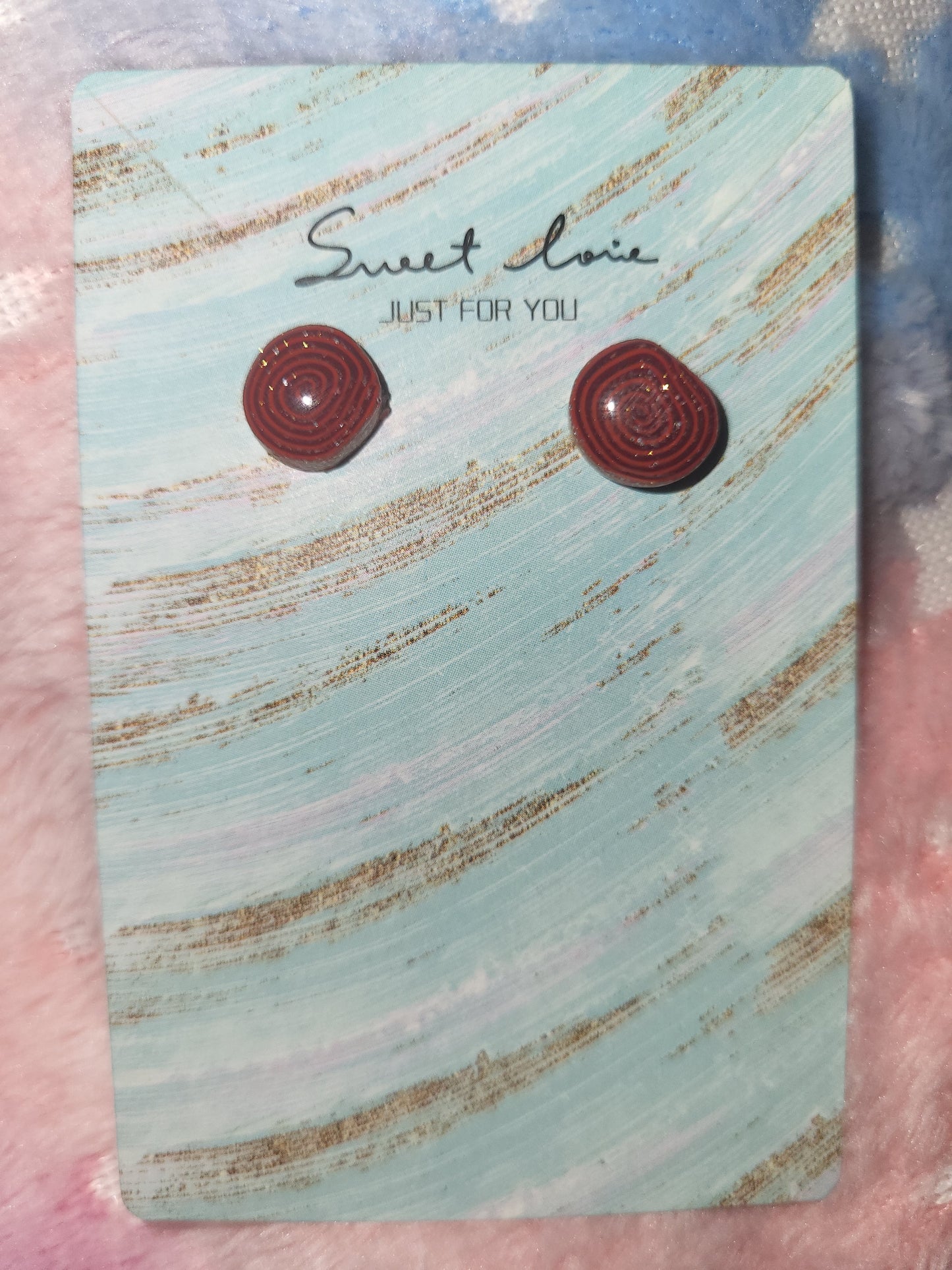 Homemade studed swirly earrings