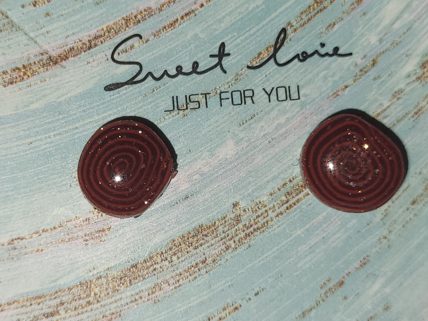 Homemade studed swirly earrings