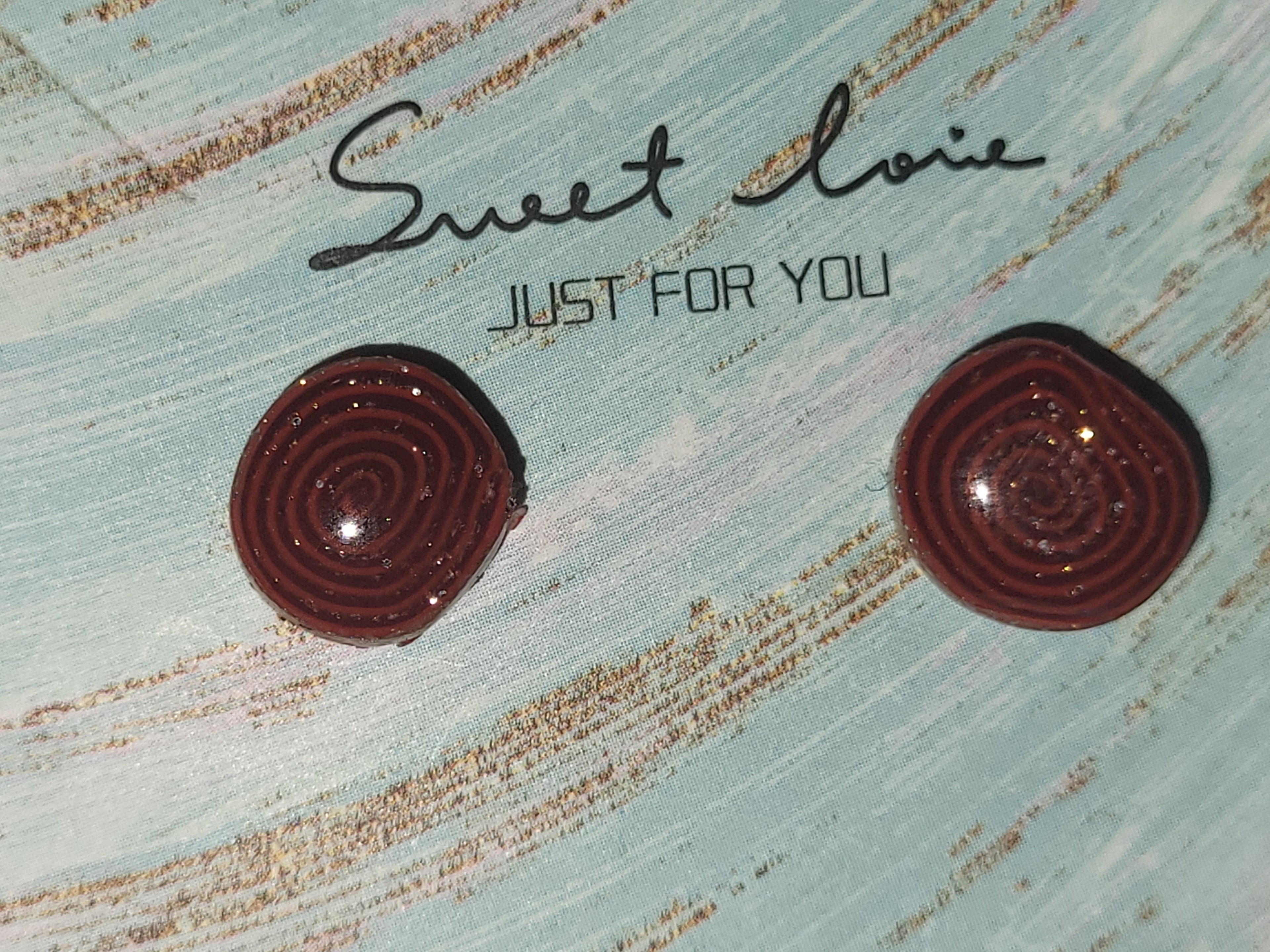 Homemade studed swirly earrings