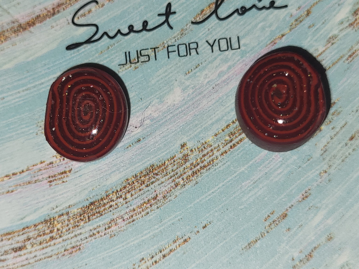 Homemade studed swirly earrings