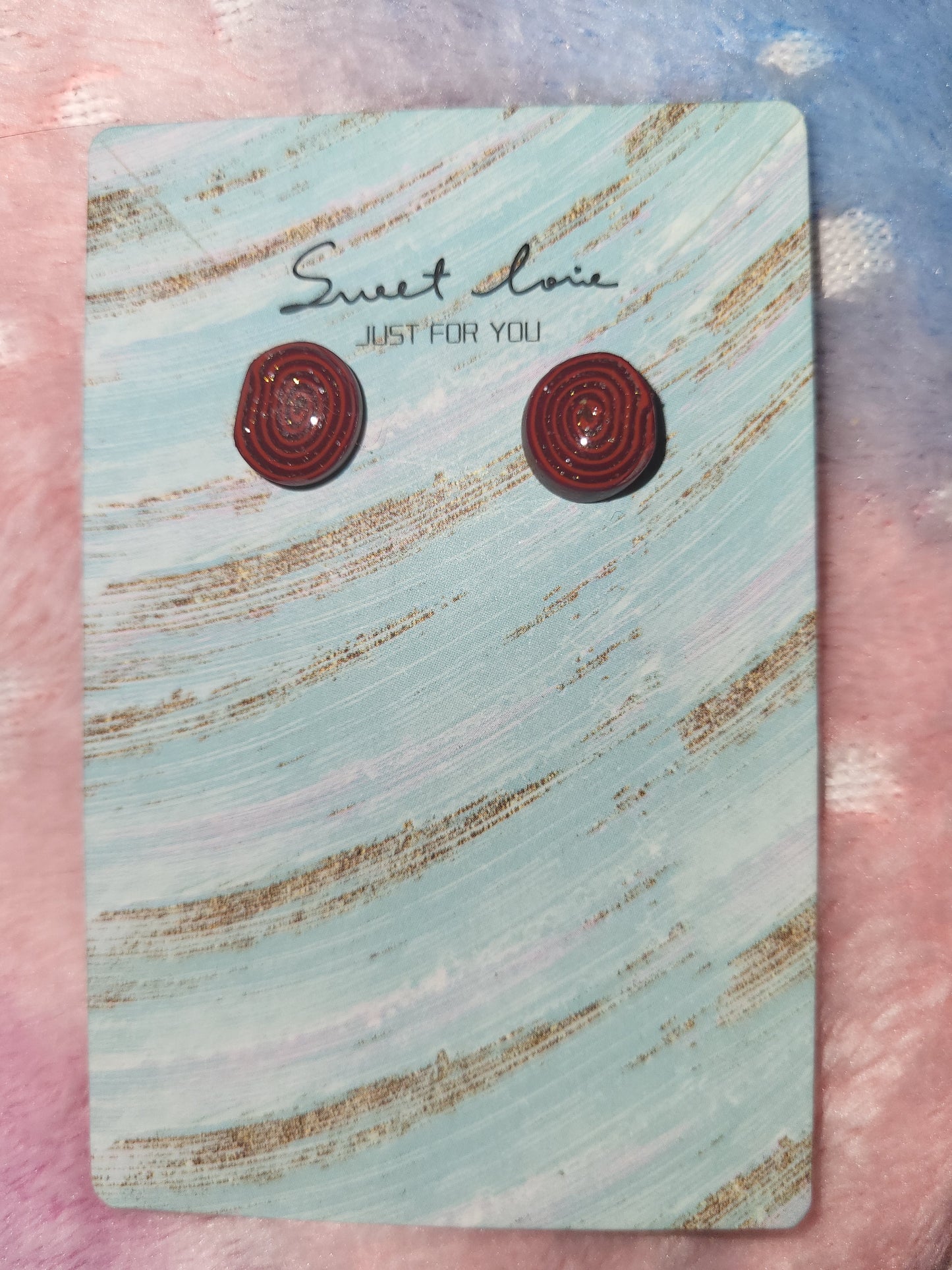 Homemade studed swirly earrings