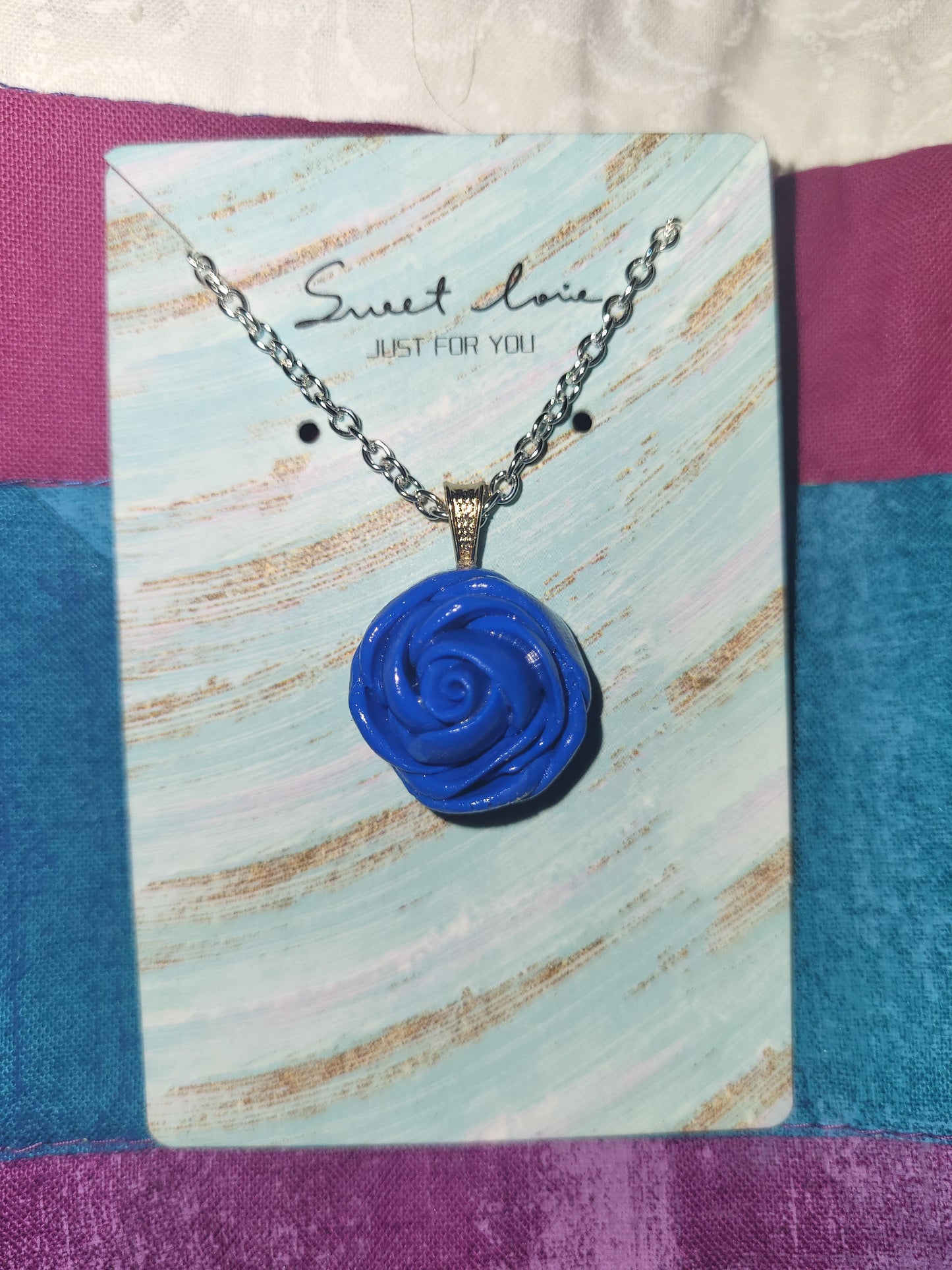 Handmade blue rose necklace