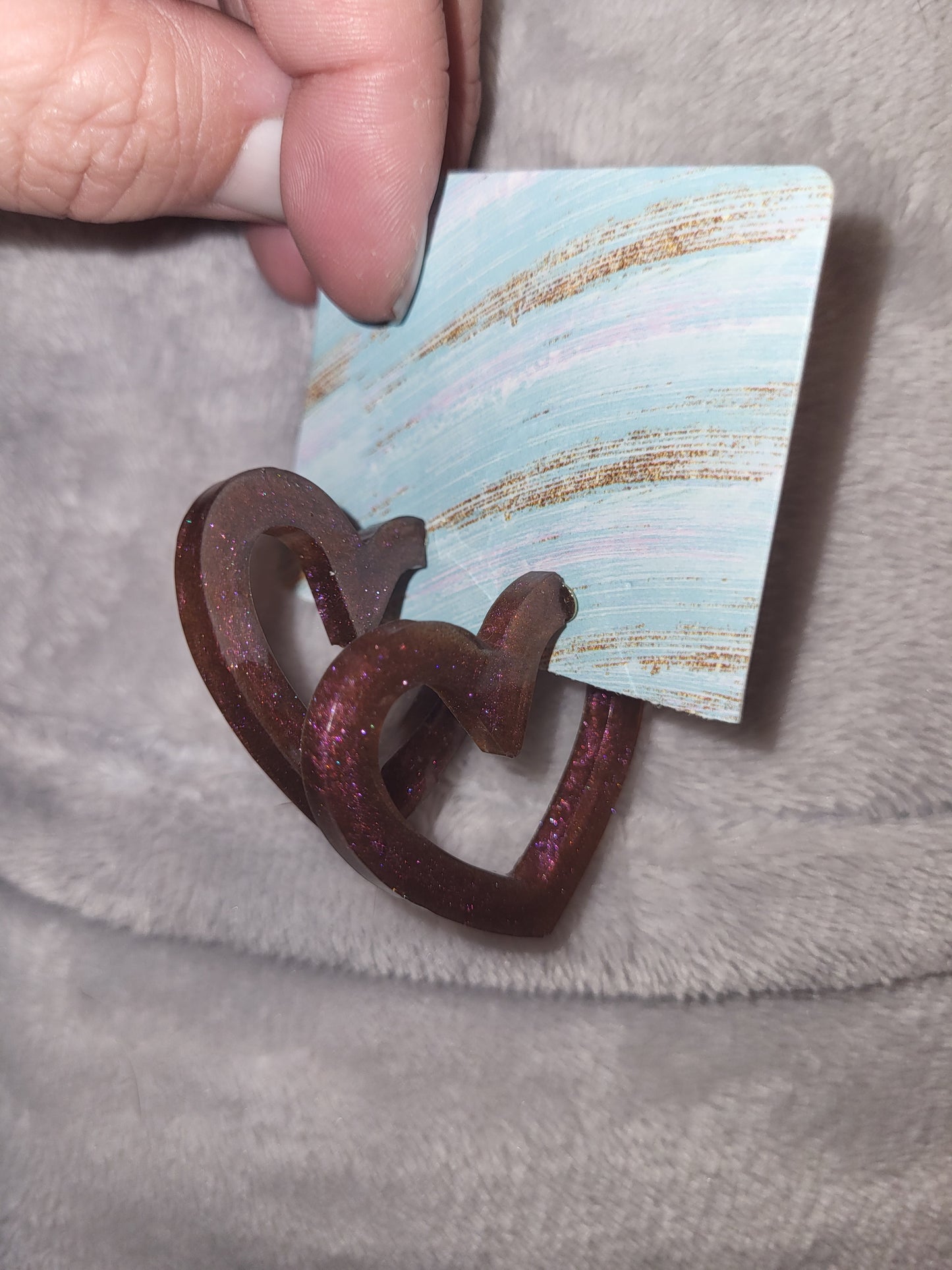 Homemade redish/purpleish heart shaped earrings