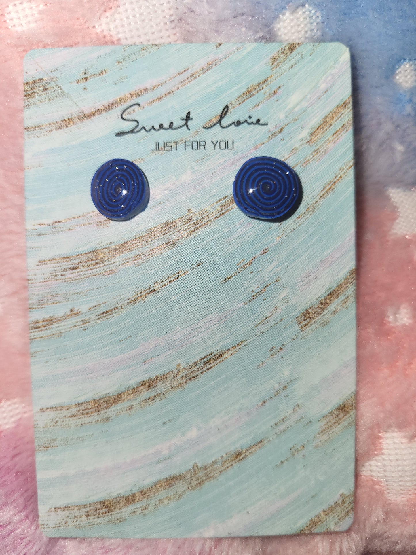 Homemade studed swirly earrings