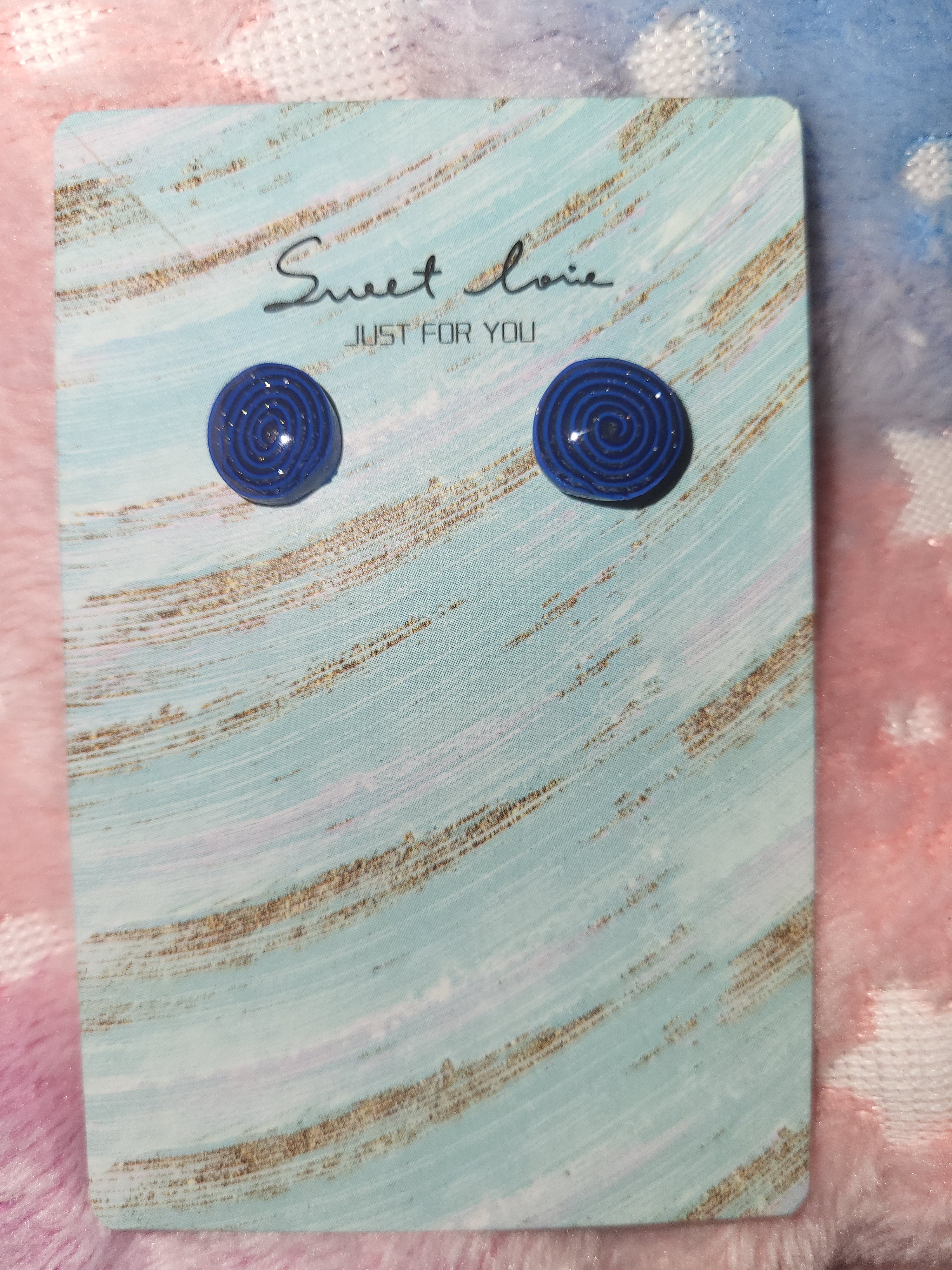 Homemade studed swirly earrings