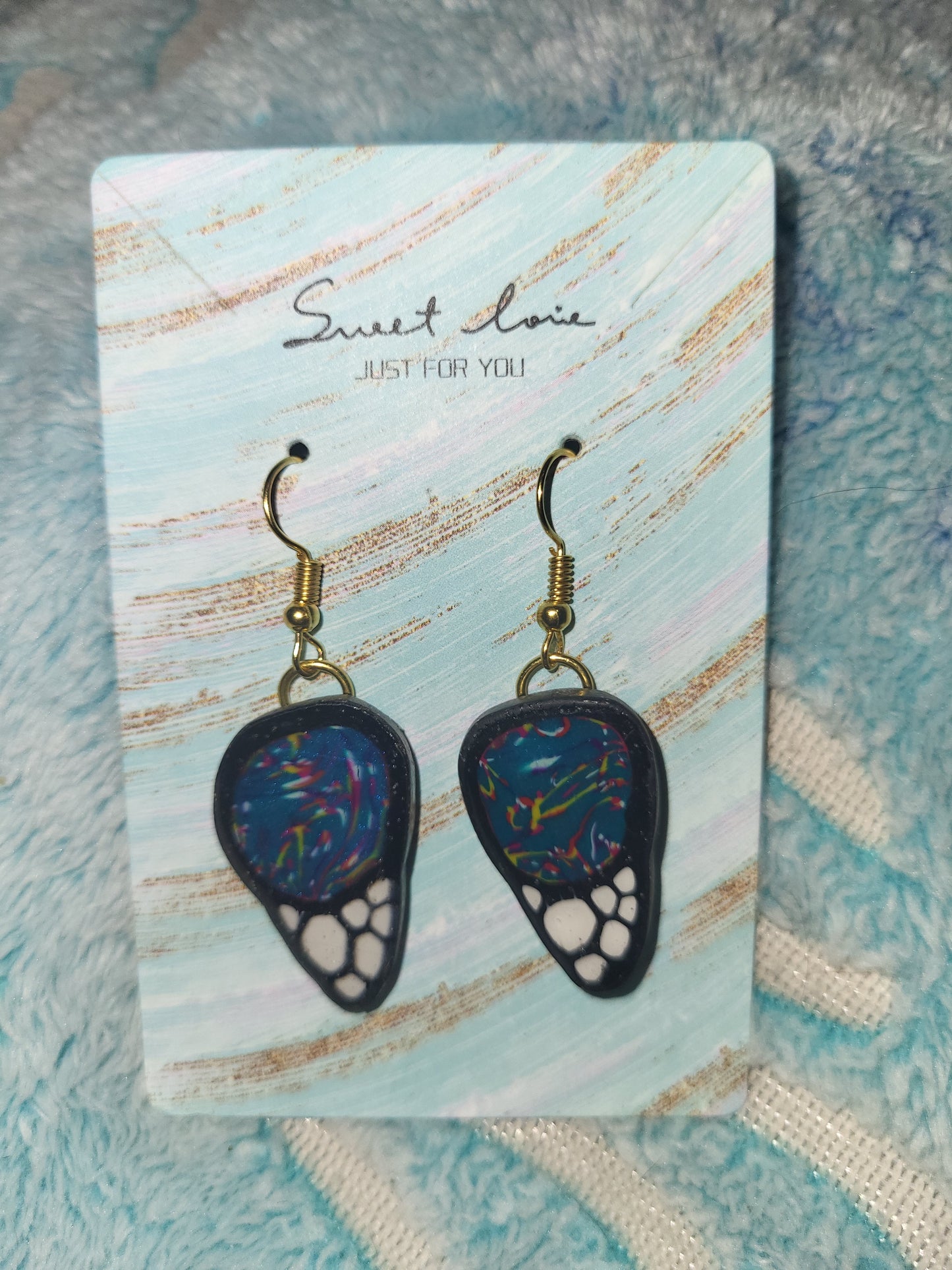 Homemade butterfly wing earrings