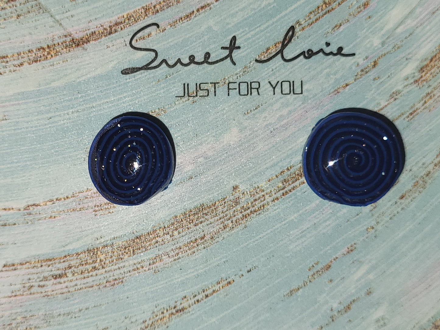 Homemade studed swirly earrings