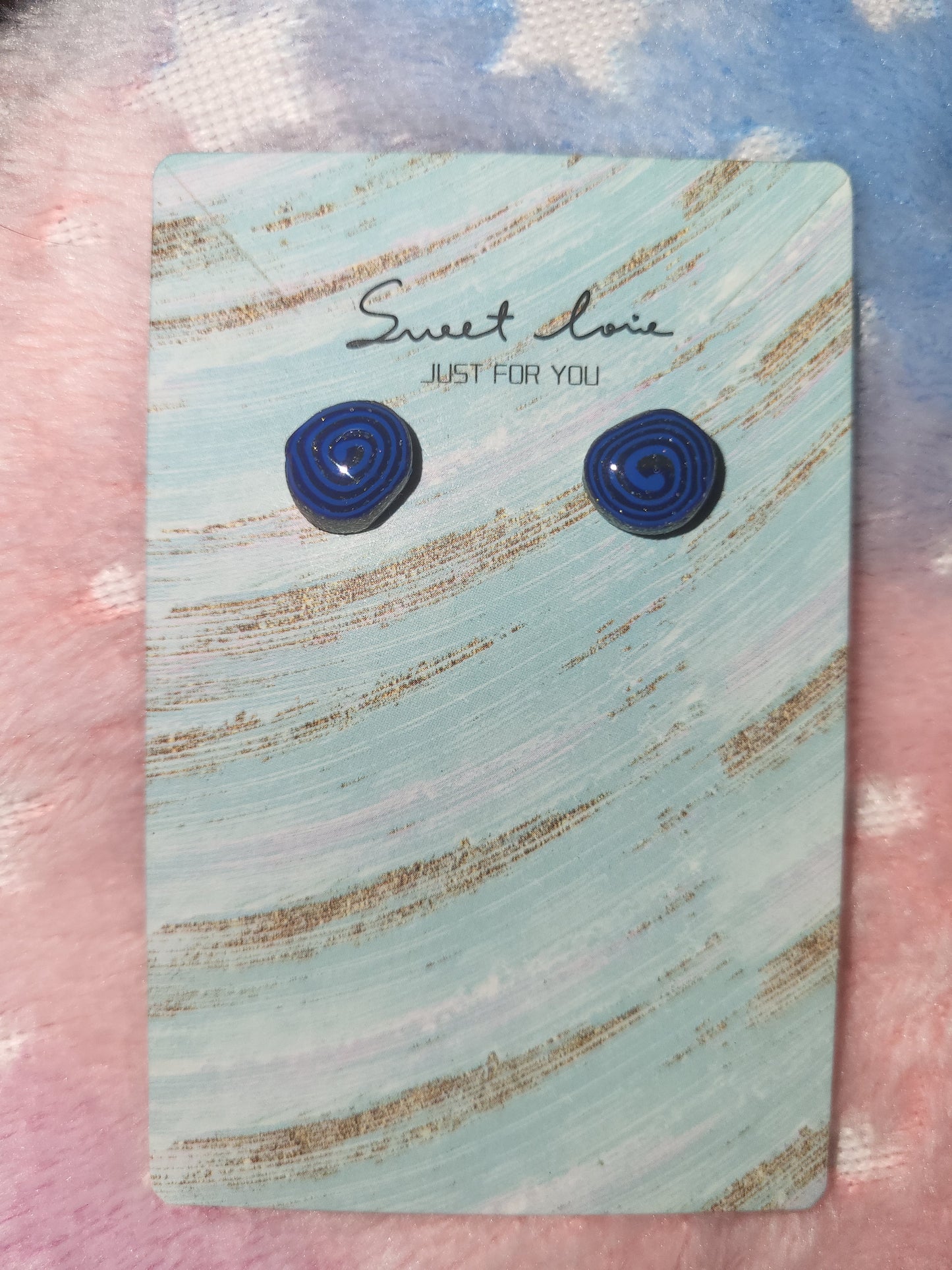 Homemade studed swirly earrings