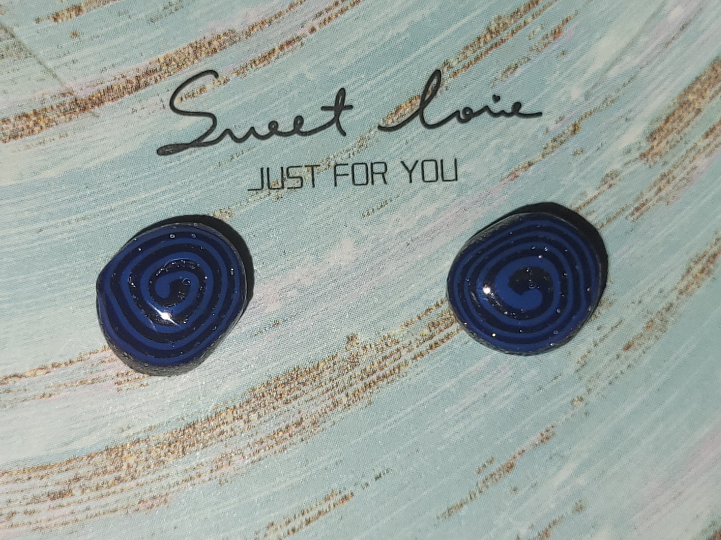 Homemade studed swirly earrings
