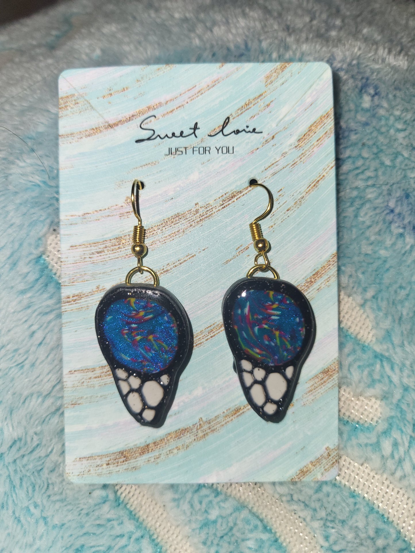 Homemade butterfly wing earrings